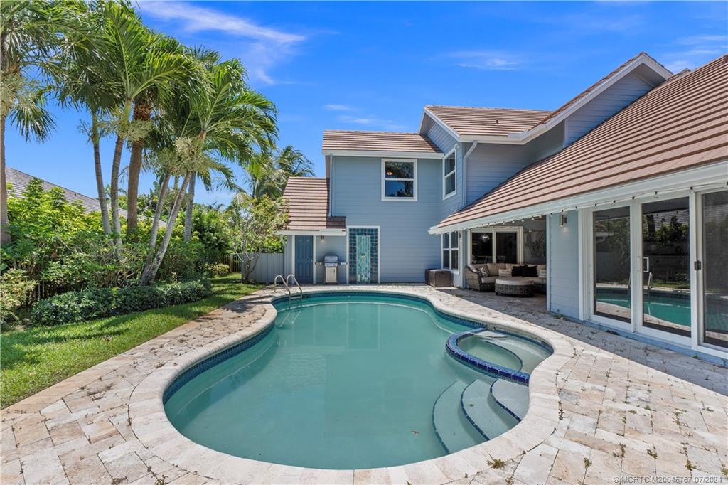 18770 Southeast River Ridge Road Jupiter, FL 33469 - Photo 62 of 81 a view of a house with swimming pool and sitting area