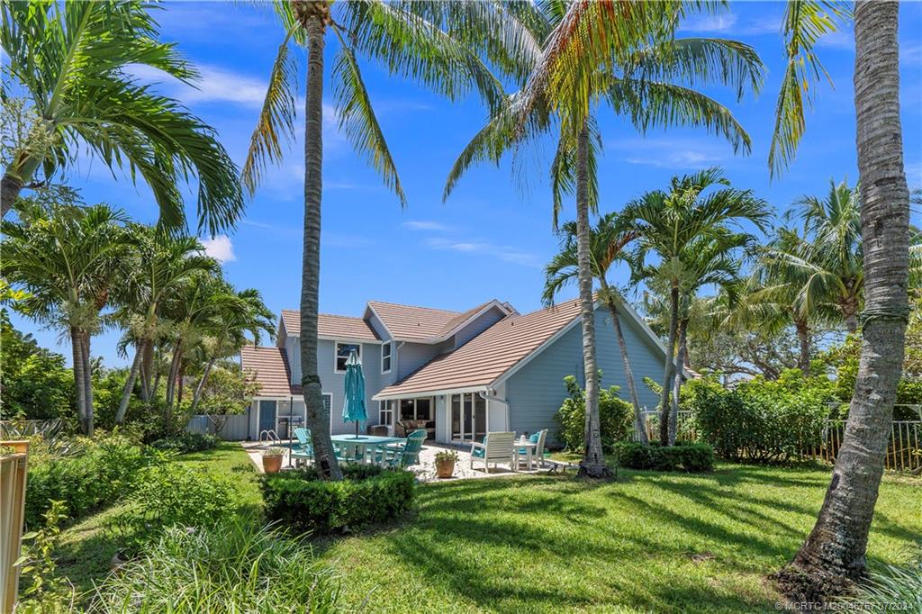 18770 Southeast River Ridge Road Jupiter, FL 33469 - Photo 64 of 81 a front view of house with yard and green space