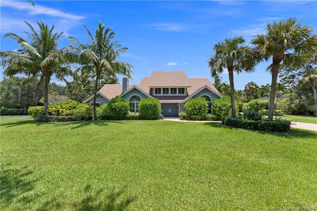 18770 Southeast River Ridge Road Jupiter, FL 33469 - Photo 66 of 81 a front view of a house with garden