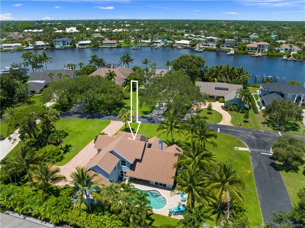 18770 Southeast River Ridge Road Jupiter, FL 33469 - Photo 78 of 81 an aerial view of lake houses with outdoor space