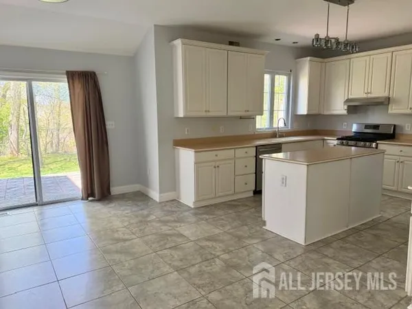 a large kitchen with cabinets and a sink