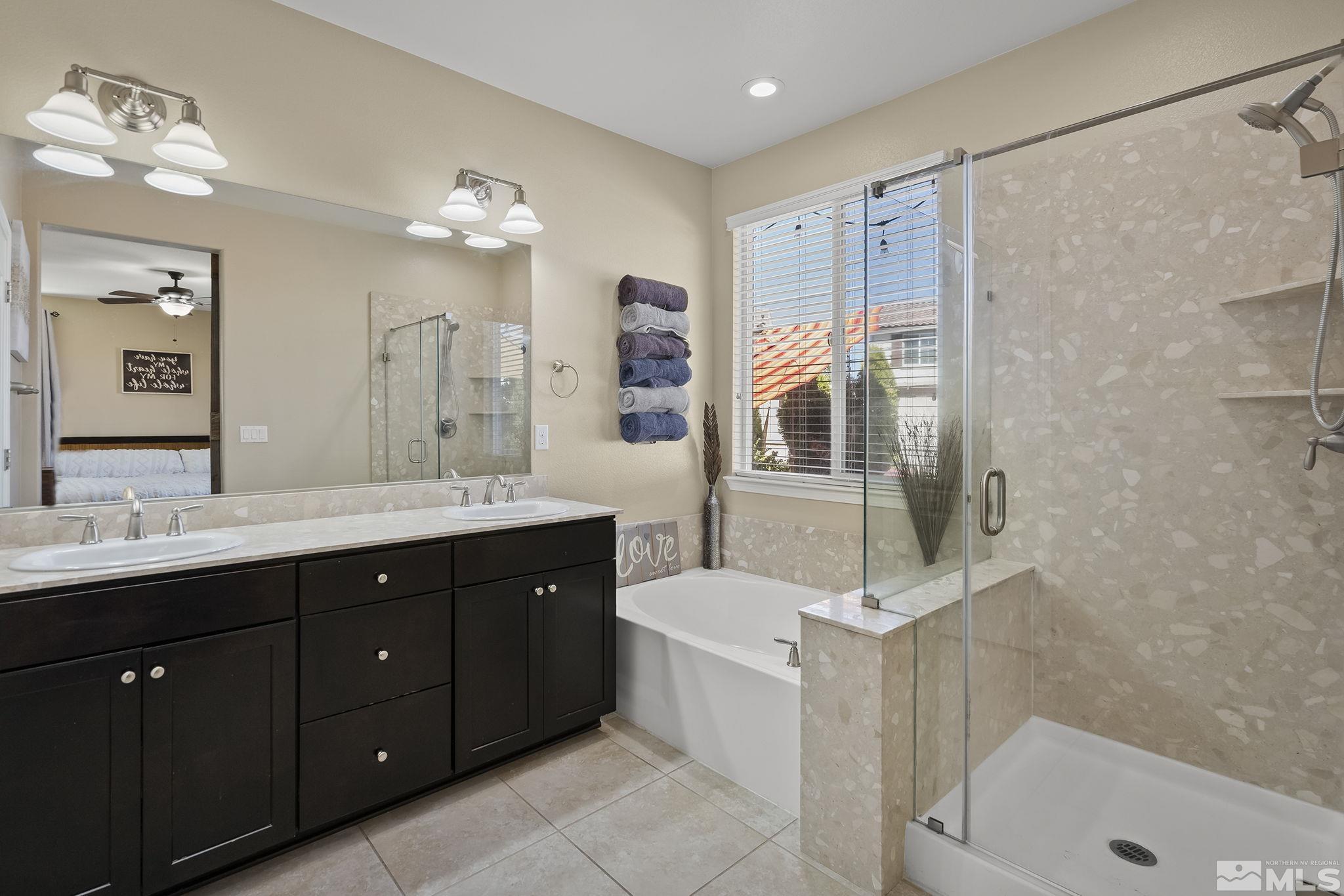 2135 Blue Oaks Drive Reno, NV 89521 - Photo 13 of 23 a spacious bathroom with a tub sink shower and mirror