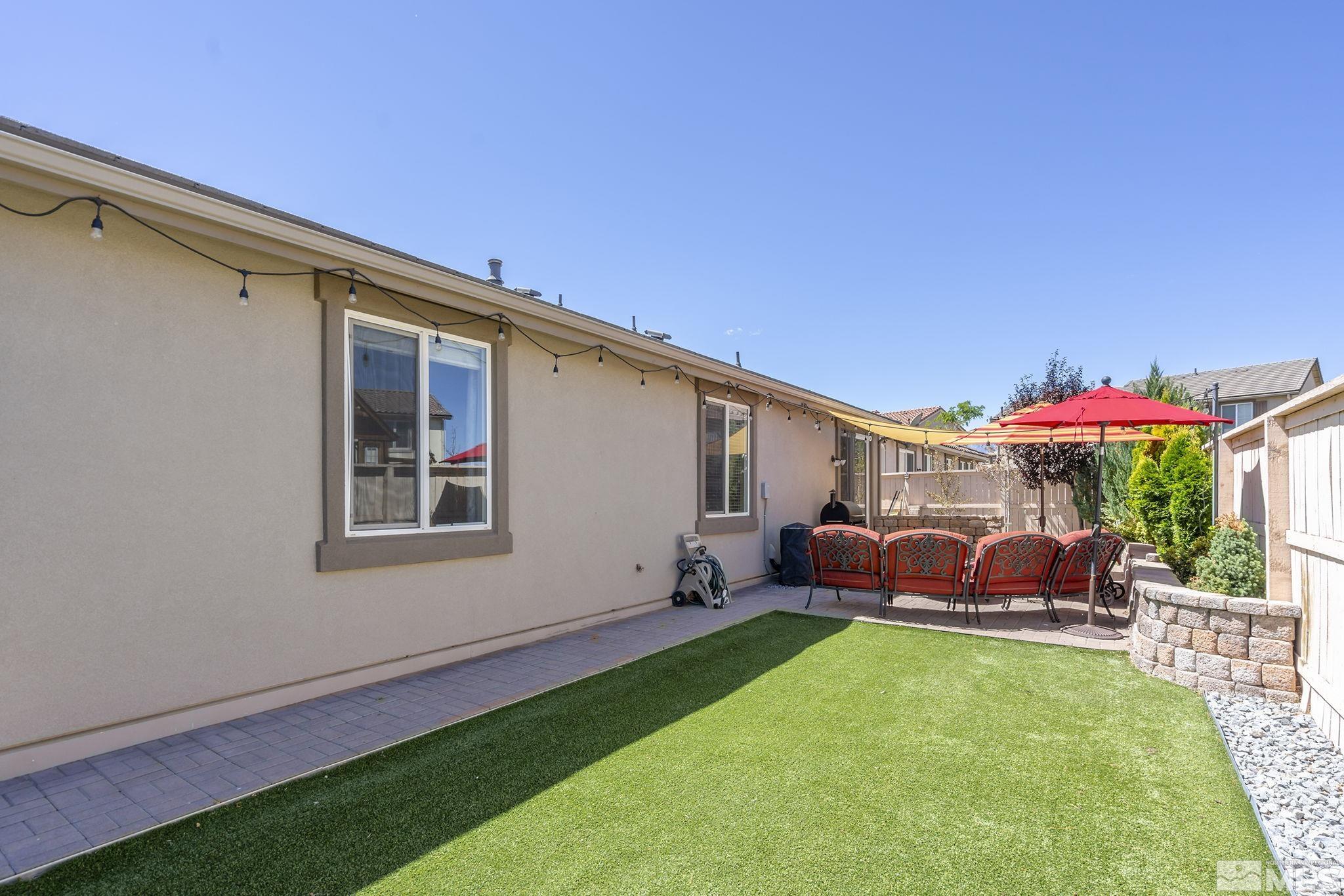 2135 Blue Oaks Drive Reno, NV 89521 - Photo 21 of 23 a backyard of a house with table and chairs