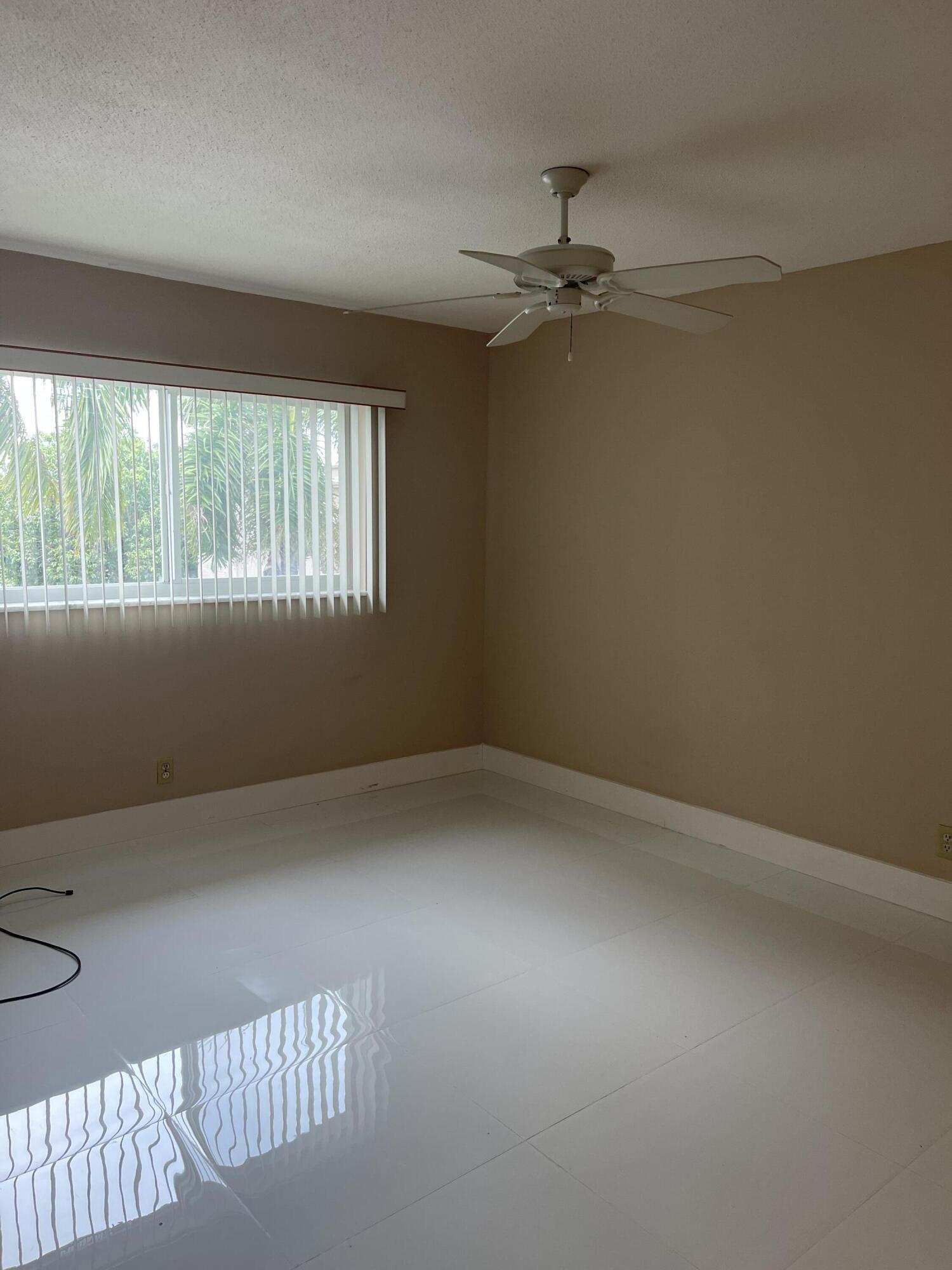 2300 Northeast 1st Lane, Unit 4020 Boynton Beach, FL 33435 - Photo 14 of 20 an empty room with a window