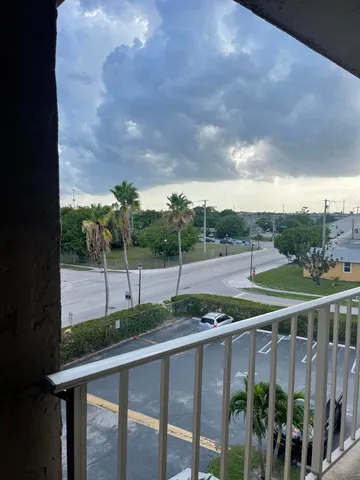 a view of a deck with a big yard