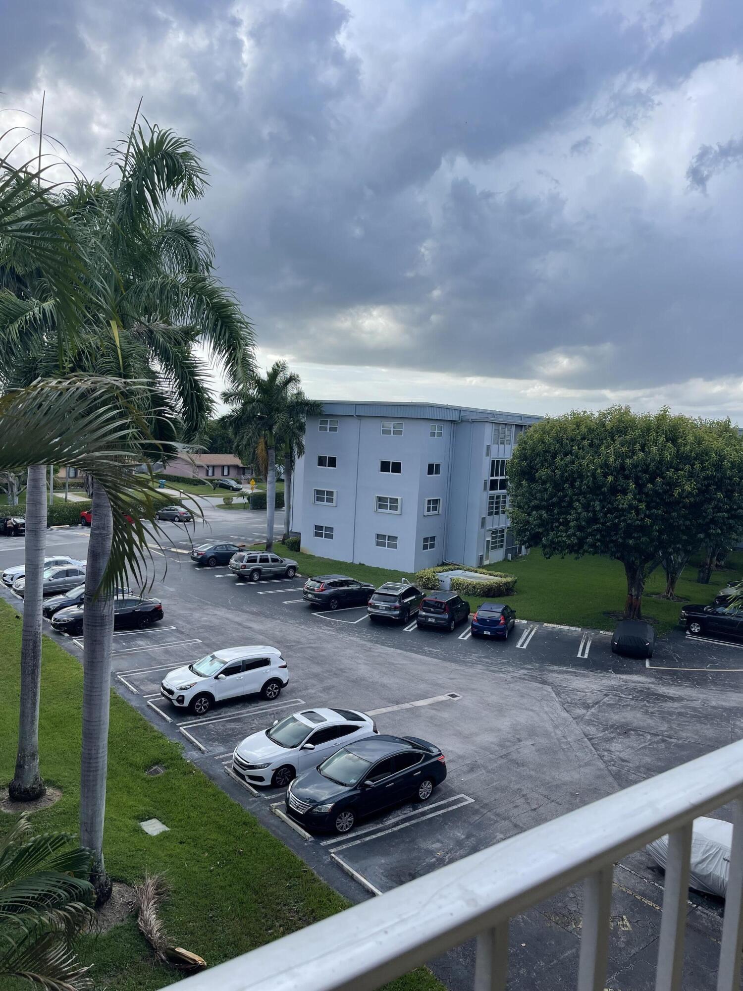 2300 Northeast 1st Lane, Unit 4020 Boynton Beach, FL 33435 - Photo 4 of 20 a view of a backyard with plants and outdoor seating