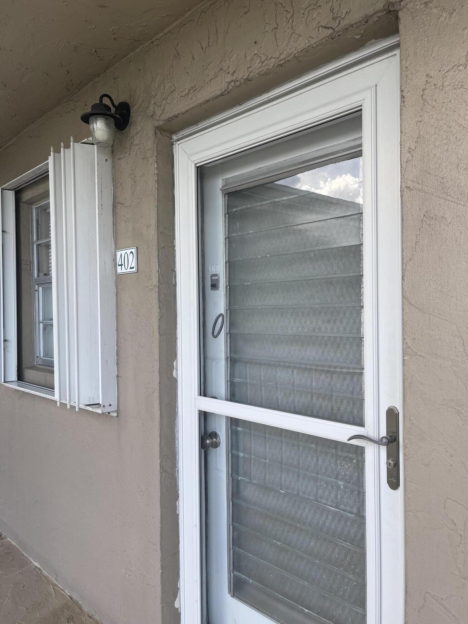 2300 Northeast 1st Lane, Unit 4020 Boynton Beach, FL 33435 - Photo 9 of 20 a bathroom with a glass shower door