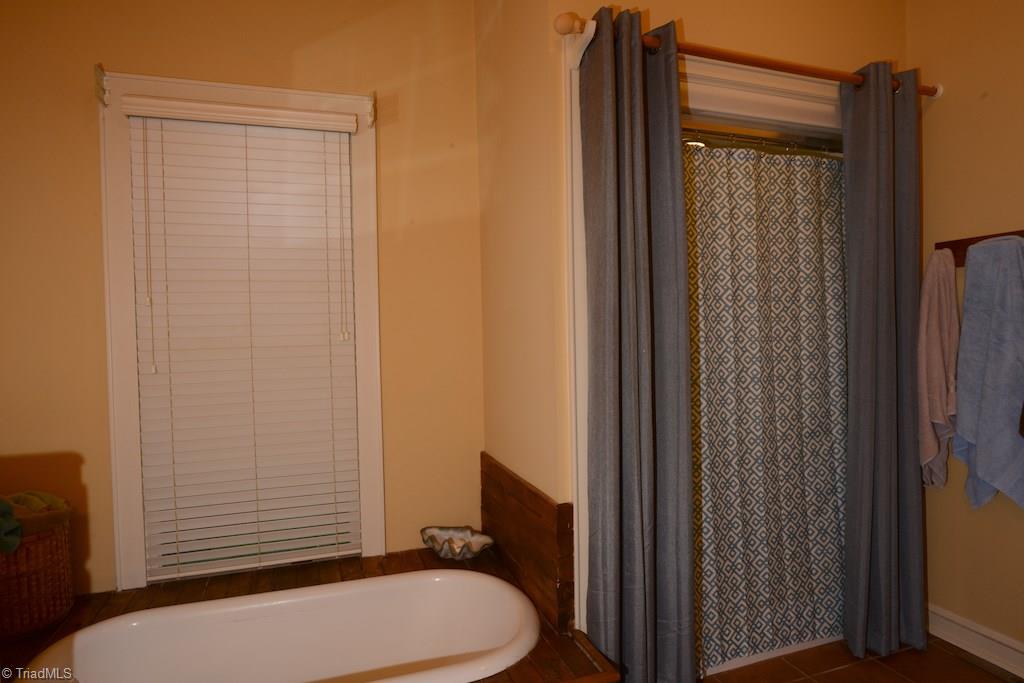 407 Walnut Grove Road Archdale, NC 27263 - Photo 19 of 30 Master bath has a separate tub and shower.
