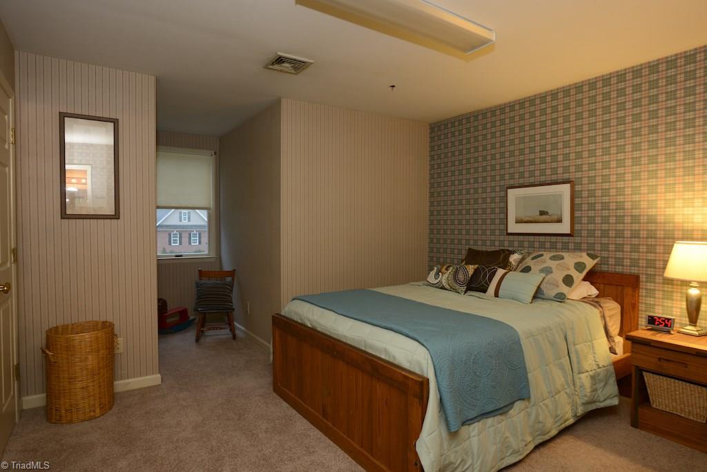 407 Walnut Grove Road Archdale, NC 27263 - Photo 20 of 30 2nd bedroom on second floor with dormer.