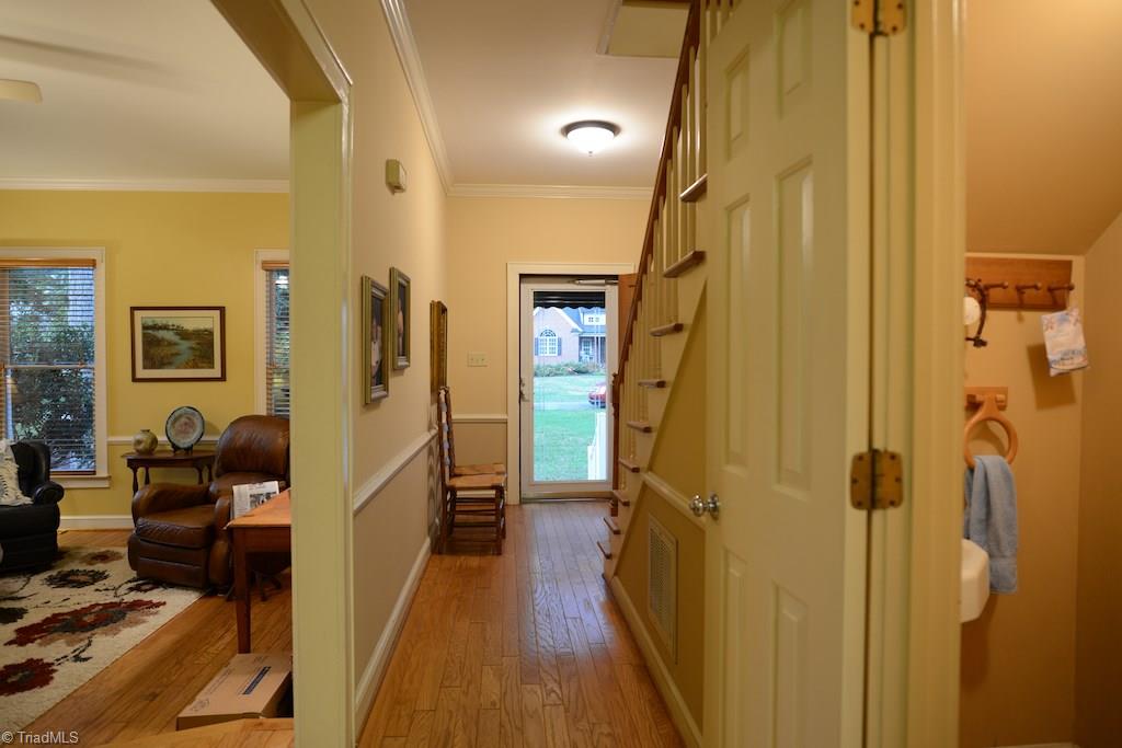 407 Walnut Grove Road Archdale, NC 27263 - Photo 3 of 30 Front hallway leads to living/dining area, powder room and eat in kitchen.