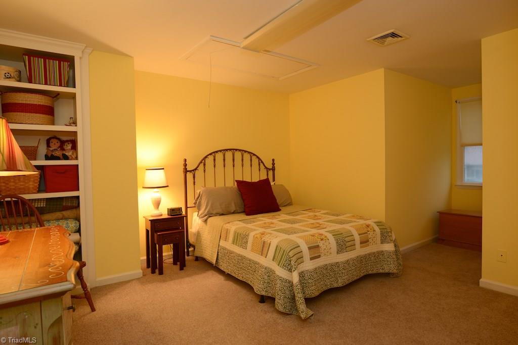 407 Walnut Grove Road Archdale, NC 27263 - Photo 21 of 30 3rd bedroom with built in shelving.