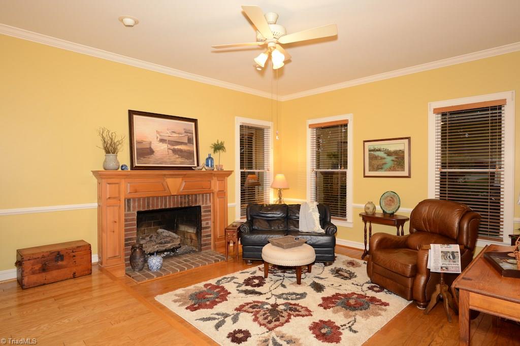 407 Walnut Grove Road Archdale, NC 27263 - Photo 5 of 30 Step down living area with beautiful fireplace.