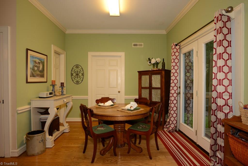 407 Walnut Grove Road Archdale, NC 27263 - Photo 8 of 30 Eating area with french doors to deck. Large pantry and laundry room are also accessible from this area.