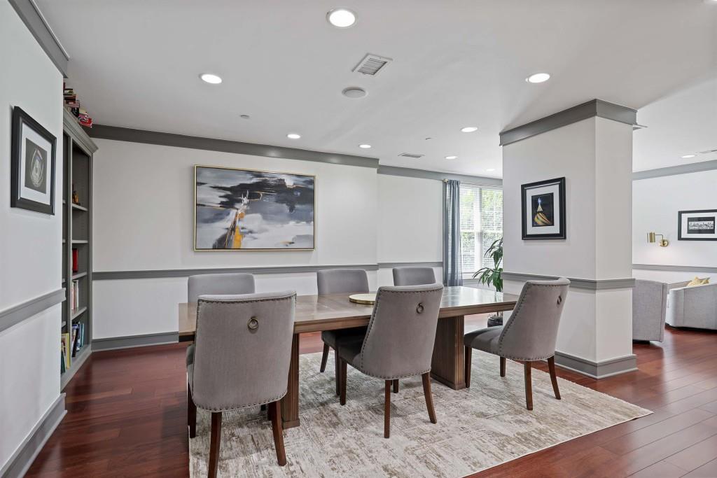 1101 Juniper Street Northeast, Unit 219 Atlanta, GA 30309 - Photo 29 of 31 a view of a dining room with furniture window and wooden floor