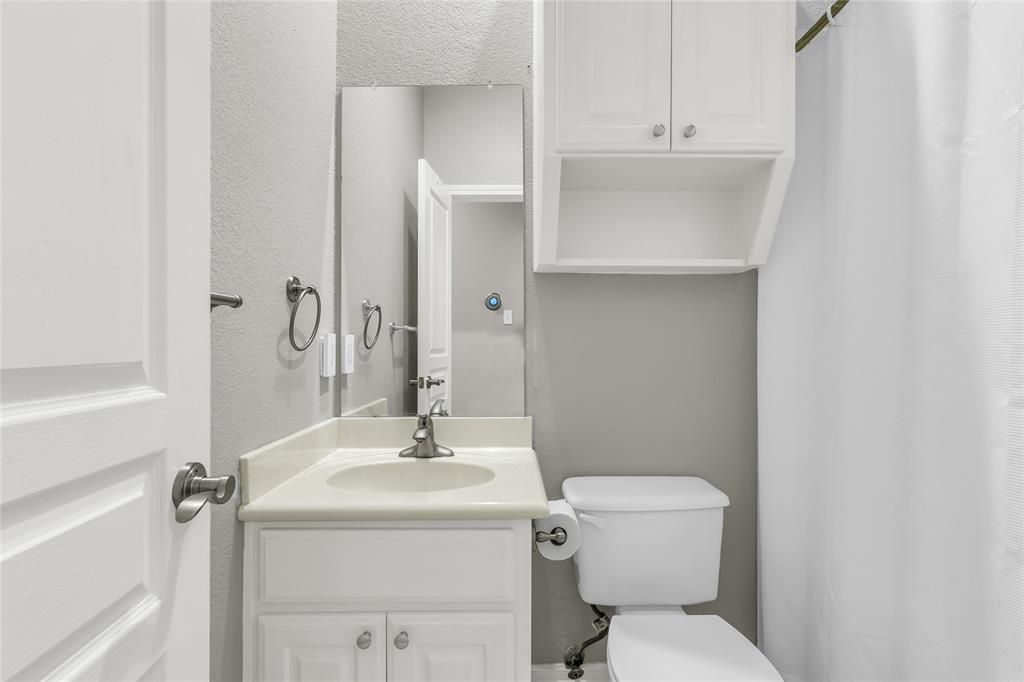 5613 Landsdown Drive Waco, TX 76708 - Photo 20 of 27 a bathroom with a sink a toilet and shower
