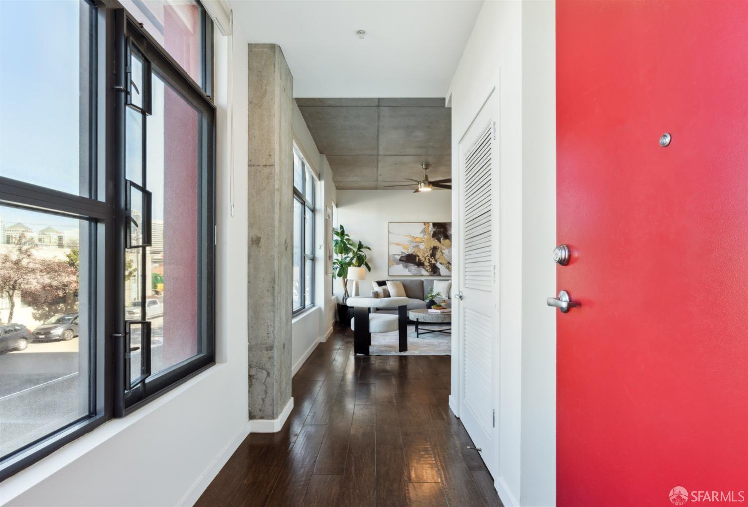 288 3rd Street, Unit 201 Oakland, CA 94607 - Photo 11 of 51 a view of a hallway with wooden floor and dining room