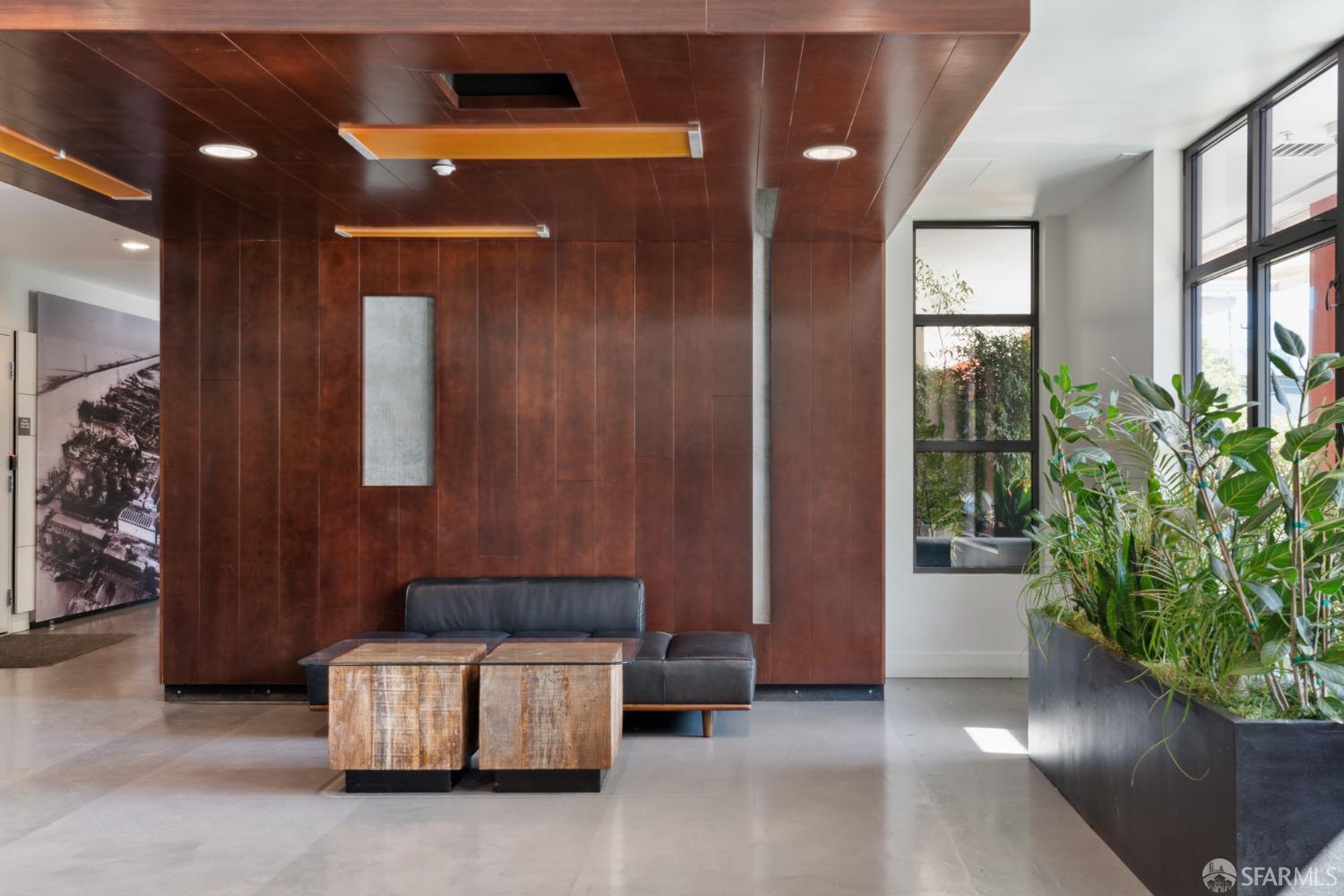 288 3rd Street, Unit 201 Oakland, CA 94607 - Photo 26 of 51 a living room with furniture and a potted plant