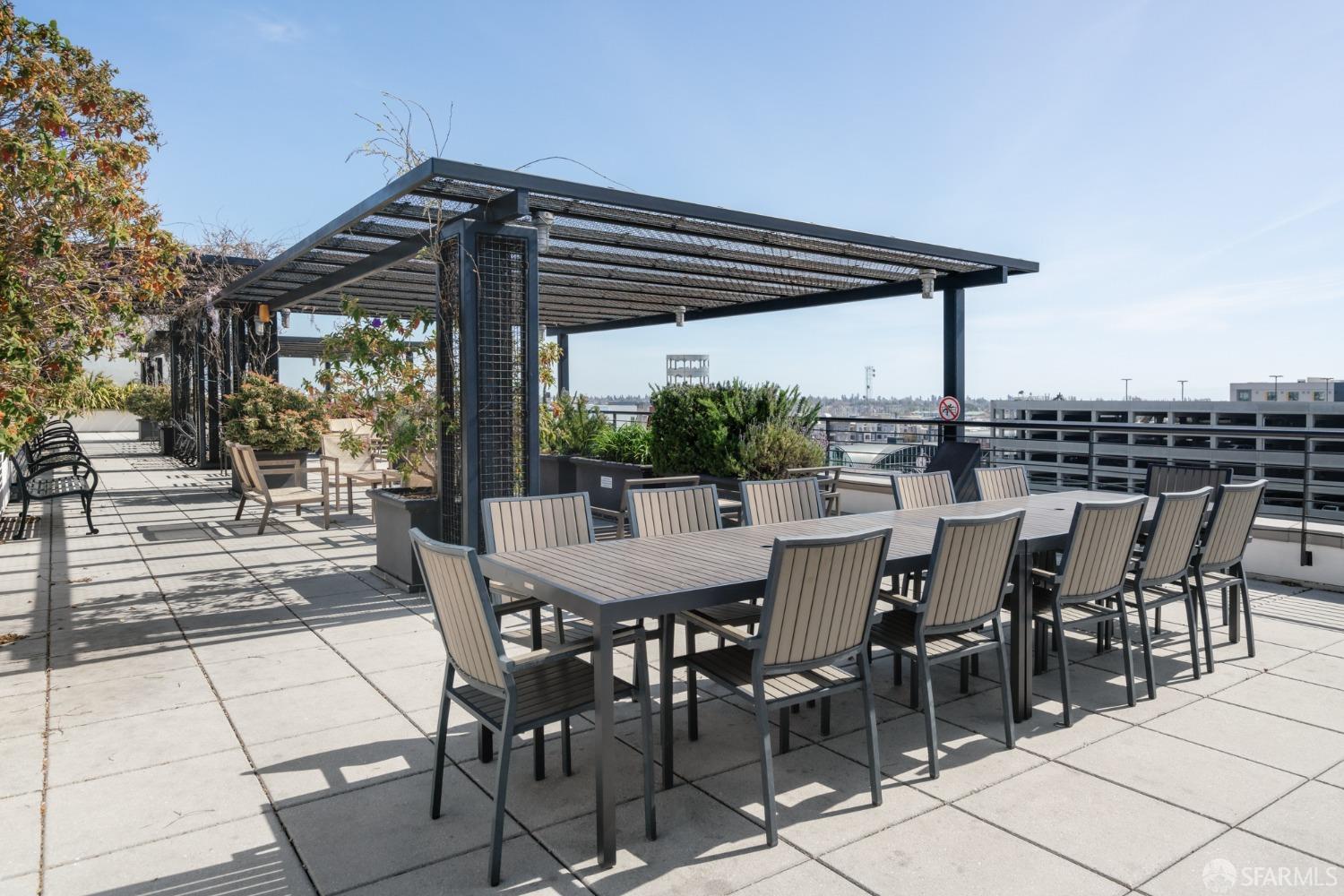 288 3rd Street, Unit 201 Oakland, CA 94607 - Photo 27 of 51 a patio with glass top table and chairs
