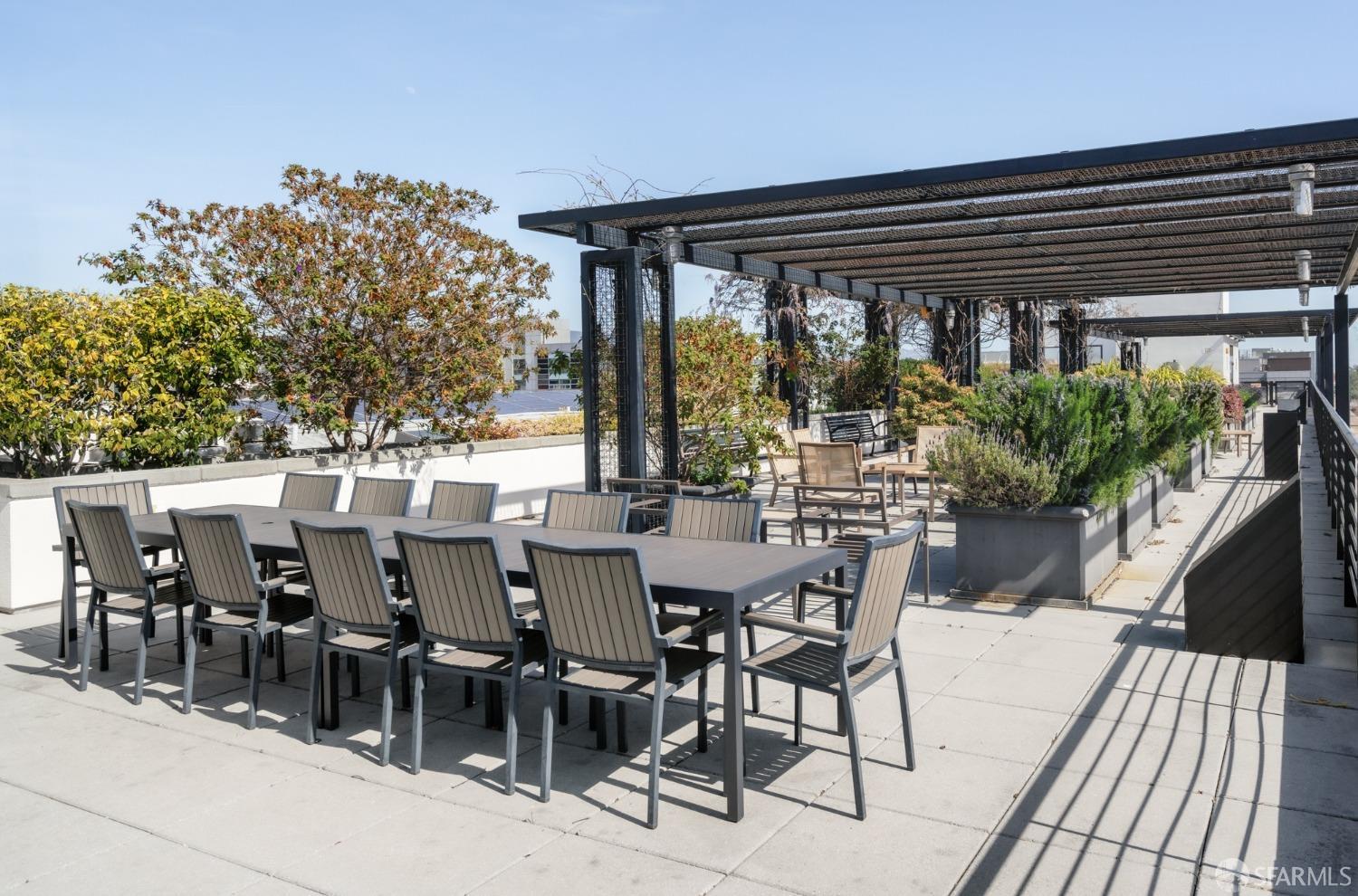288 3rd Street, Unit 201 Oakland, CA 94607 - Photo 28 of 51 a view of a patio with table and chairs and potted plants