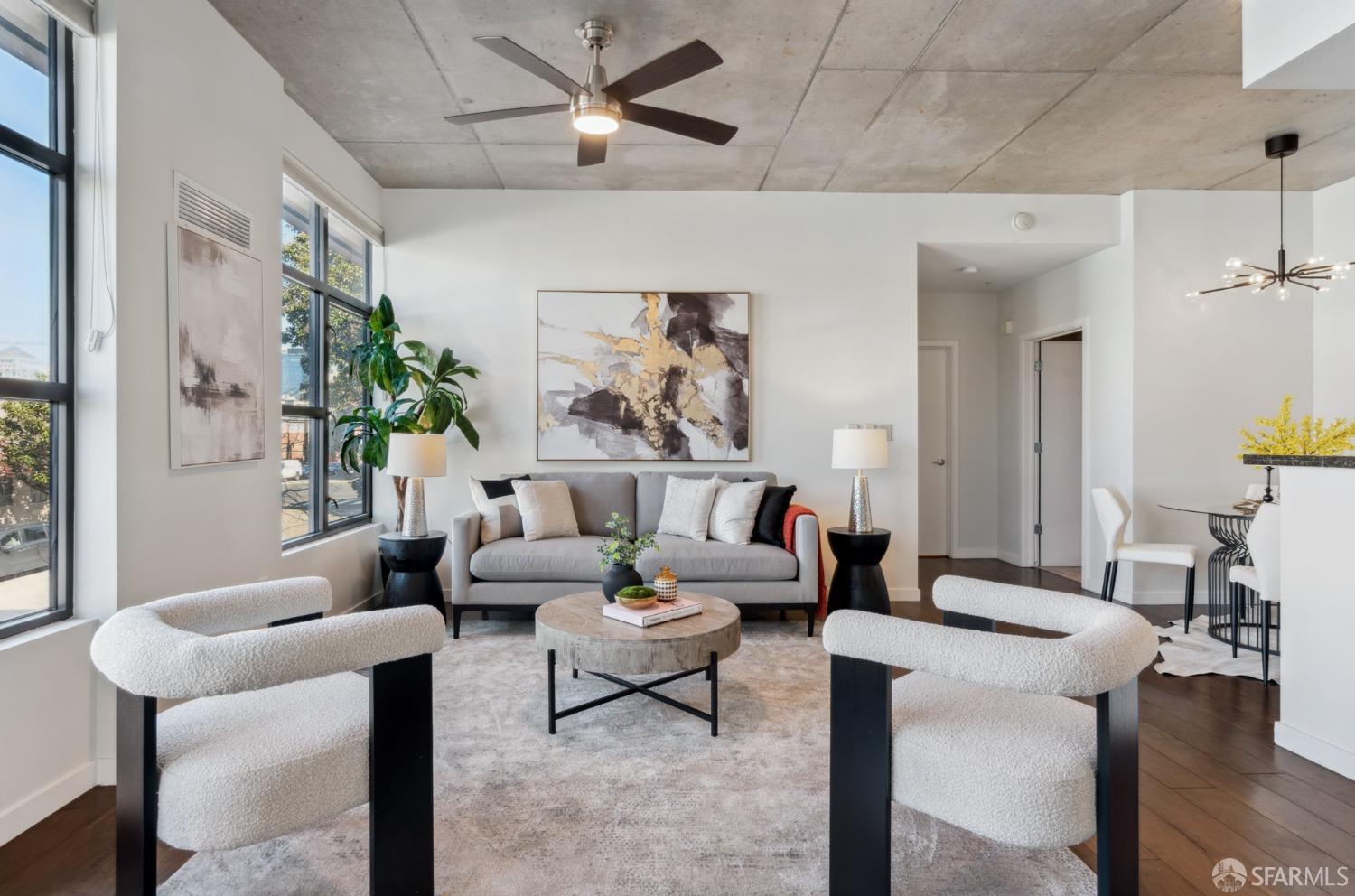 288 3rd Street, Unit 201 Oakland, CA 94607 - Photo 3 of 51 a living room with furniture and a large window