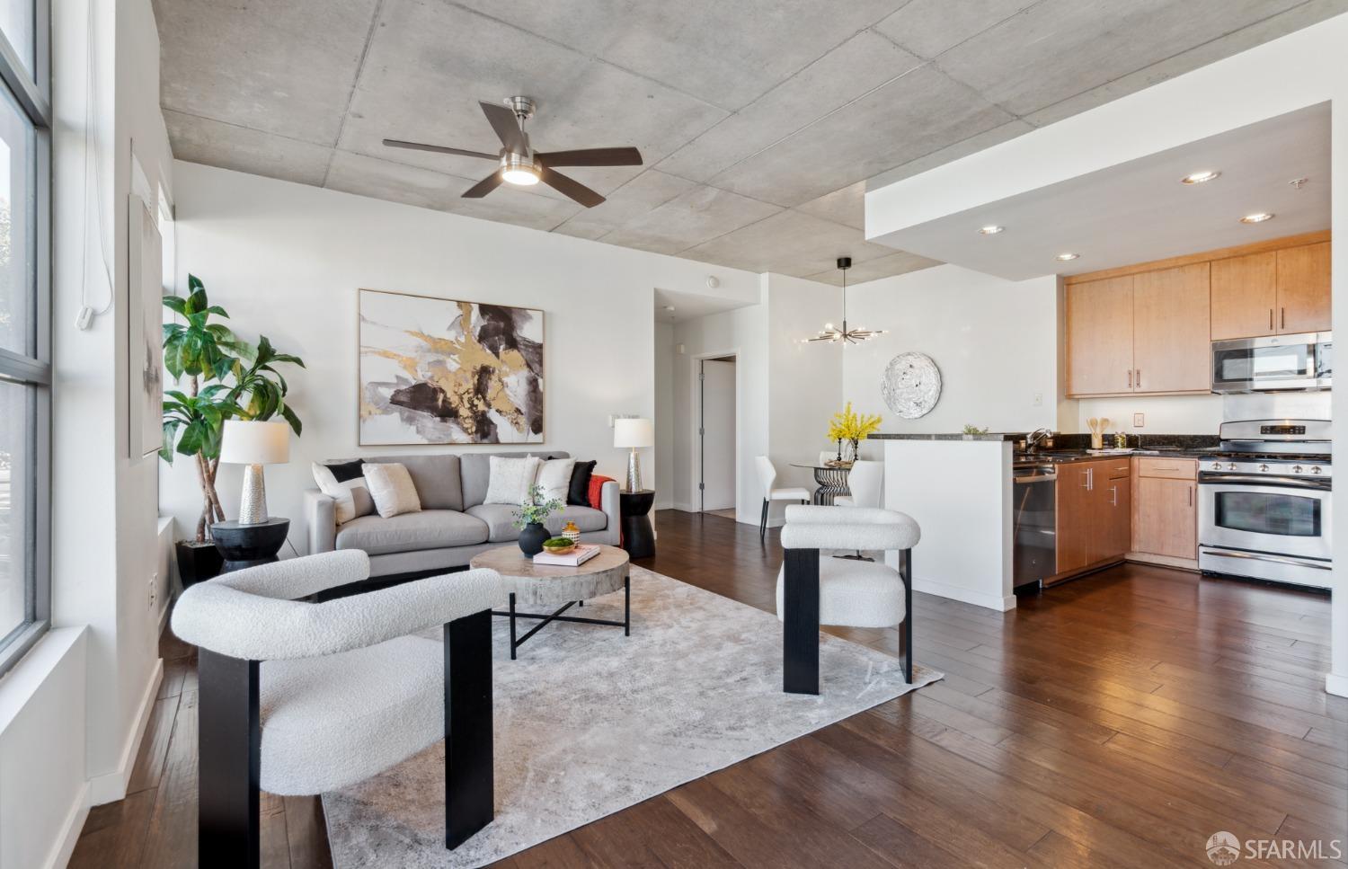 288 3rd Street, Unit 201 Oakland, CA 94607 - Photo 5 of 51 a living room with furniture and kitchen view