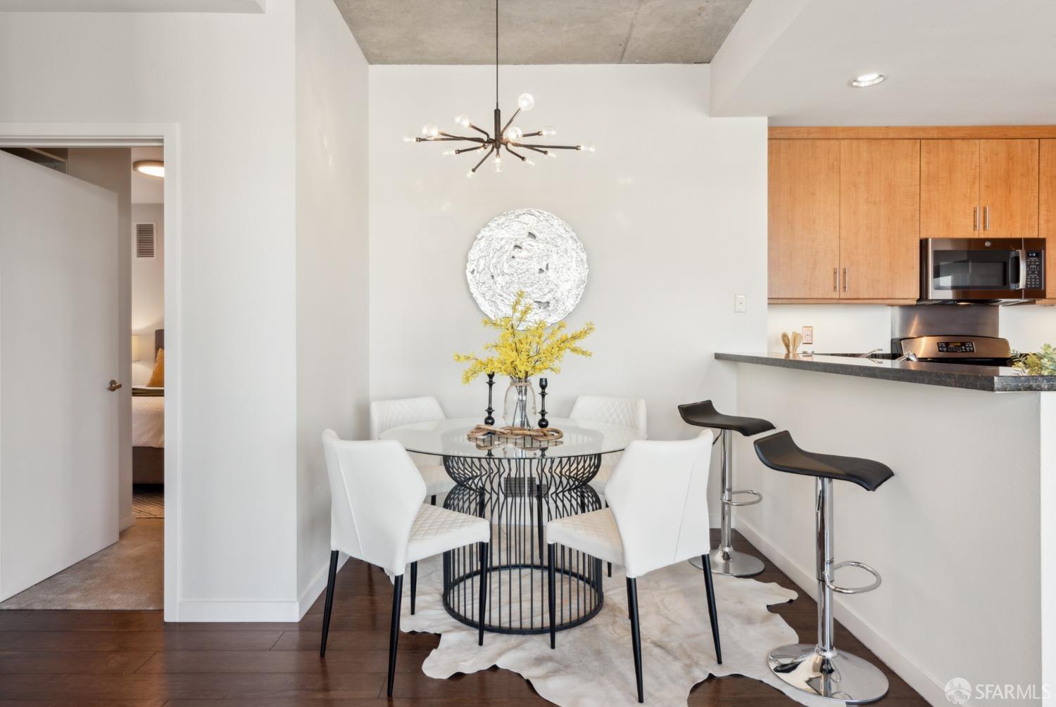 288 3rd Street, Unit 201 Oakland, CA 94607 - Photo 9 of 51 a view of a dining room with furniture and wooden floor