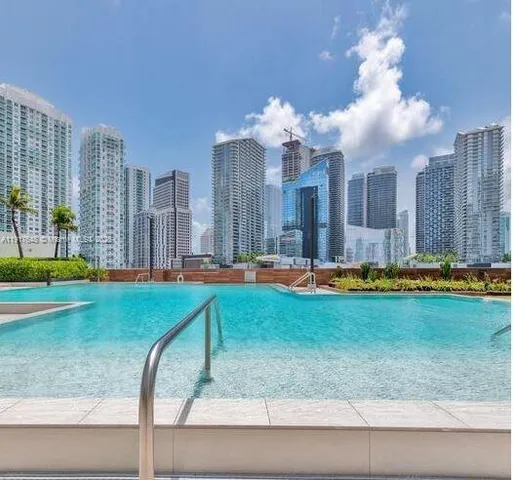 a view of a patio with a table and chairs