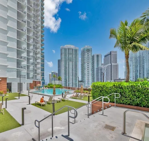 a front view of a building with garden