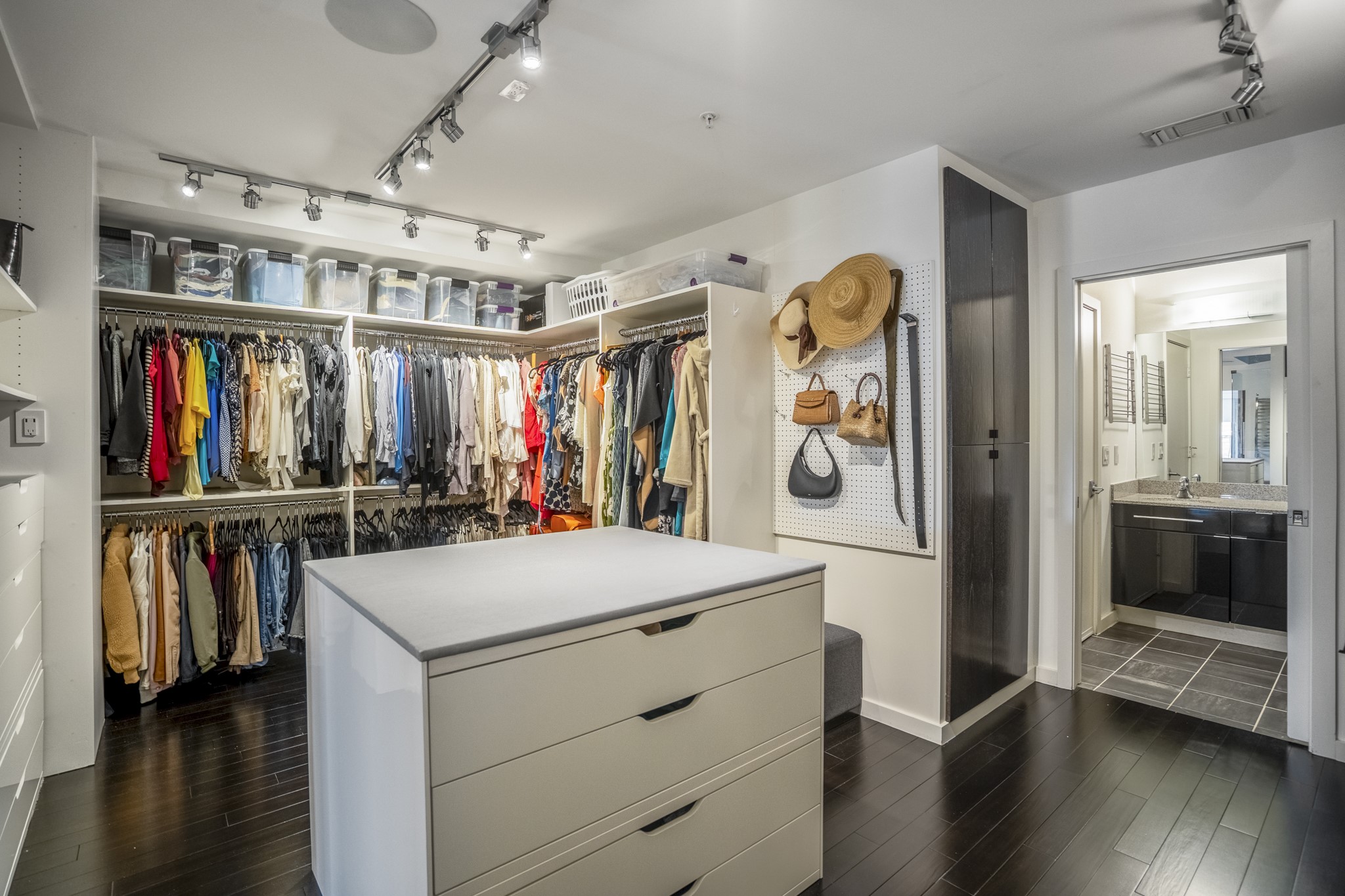 102 Quitman Street, Unit 405 Houston, TX 77009 - Photo 26 of 46 a view of walk in closet with clothes and shoes
