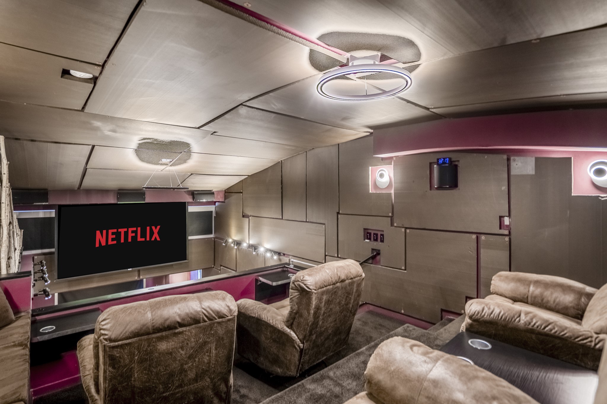 102 Quitman Street, Unit 405 Houston, TX 77009 - Photo 36 of 46 a projector room with a projector and couches