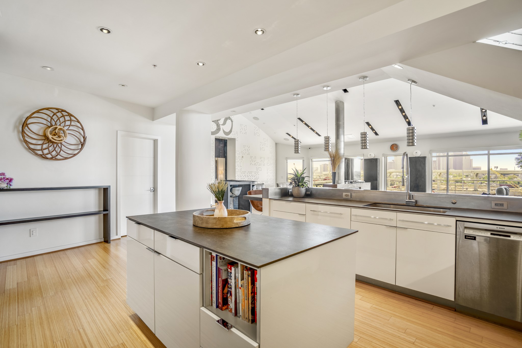102 Quitman Street, Unit 405 Houston, TX 77009 - Photo 10 of 46 a kitchen with a sink cabinets and wooden floor