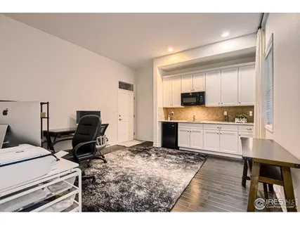 a spacious bathroom with a bathtub sink and mirror