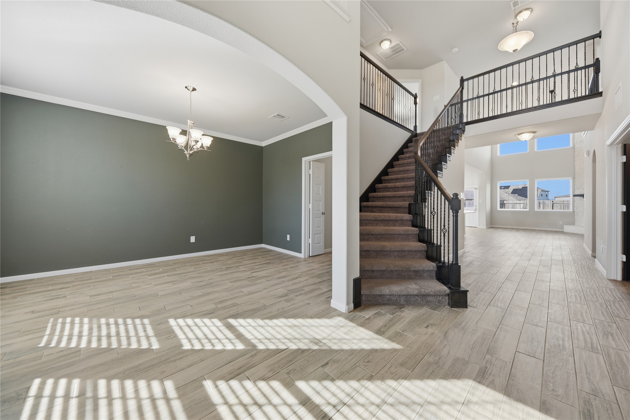 4316 Mocking Run Lane Dickinson, TX 77539 - Photo 6 of 24 Entering through the foyer, you have the dining room on the left and the eye catching stair case.
