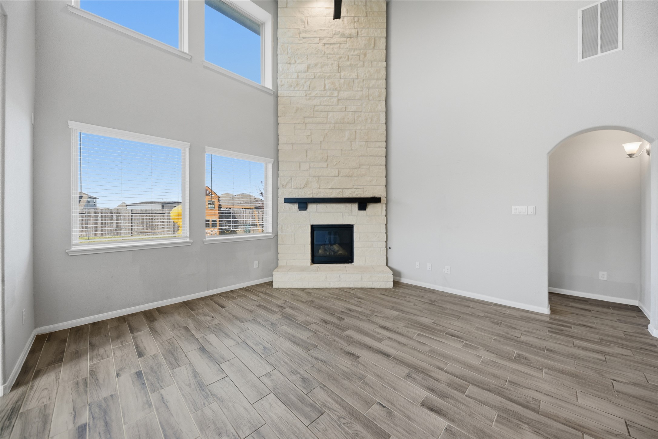 4316 Mocking Run Lane Dickinson, TX 77539 - Photo 7 of 24 Floor to ceiling (18 foot) stone fireplace that is gas.