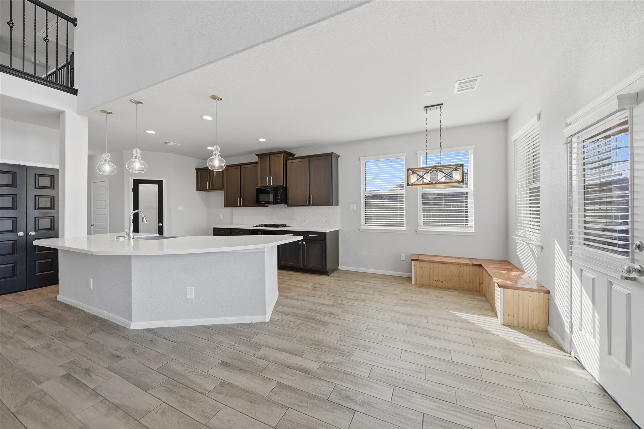 4316 Mocking Run Lane Dickinson, TX 77539 - Photo 9 of 24 Kitchen open to breakfast area and living room