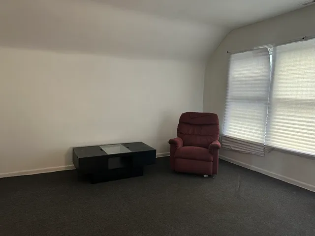 a room with a window and a couch