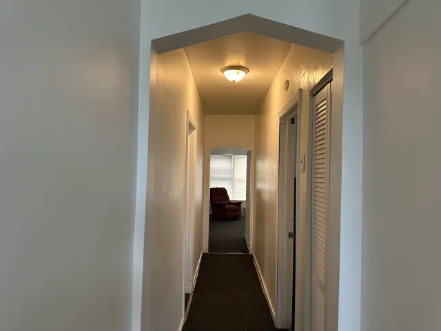 a view of a hallway view with a mirror