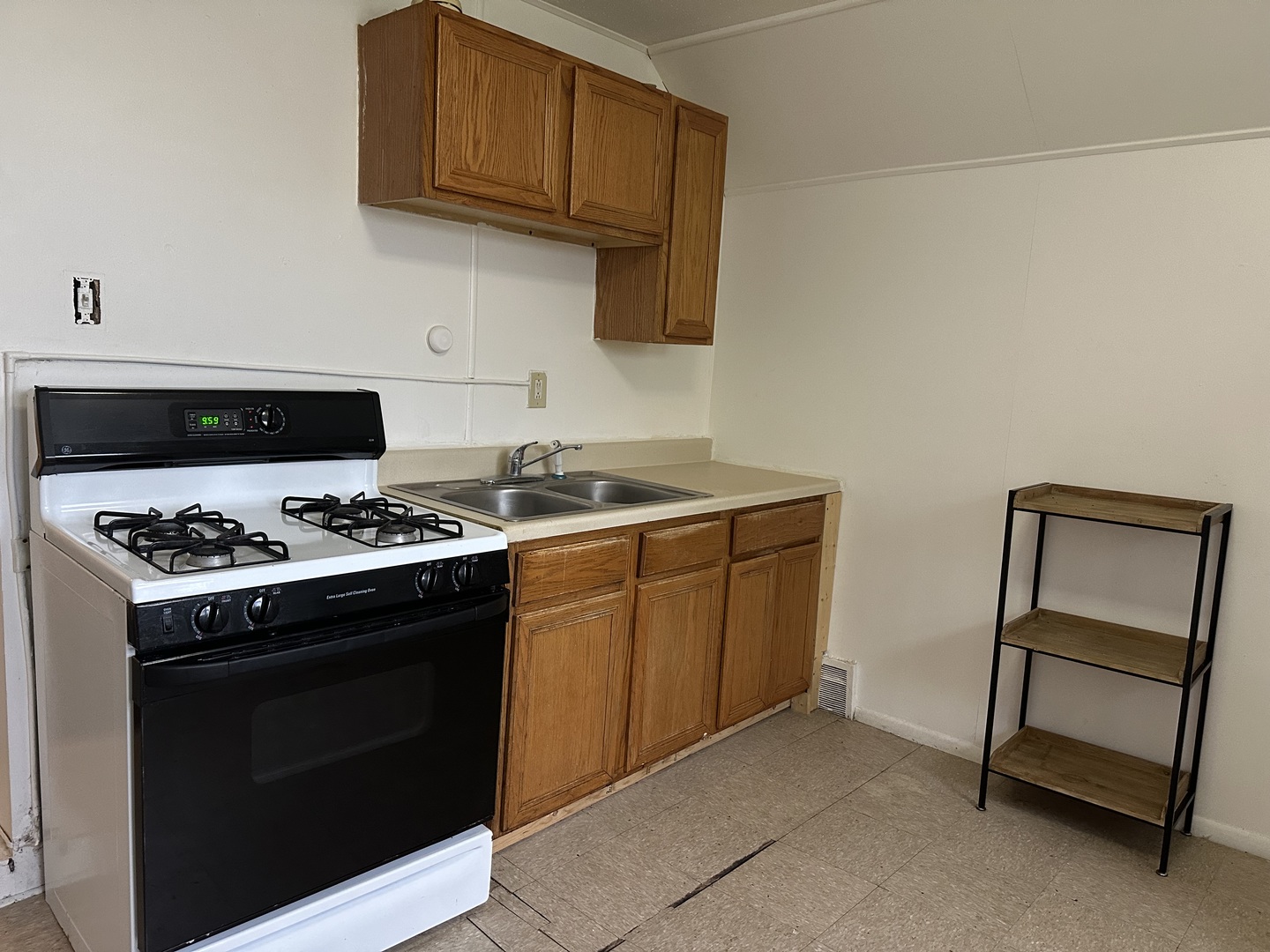 7710 South Ada Street, Unit 2 Chicago, IL 60620 - Photo 9 of 10 a stove top oven sitting inside of a kitchen