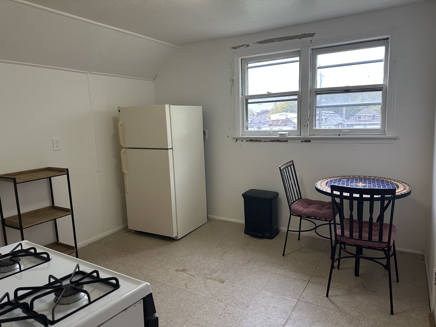 7710 South Ada Street, Unit 2 Chicago, IL 60620 - Photo 10 of 10 a living room with furniture and a window