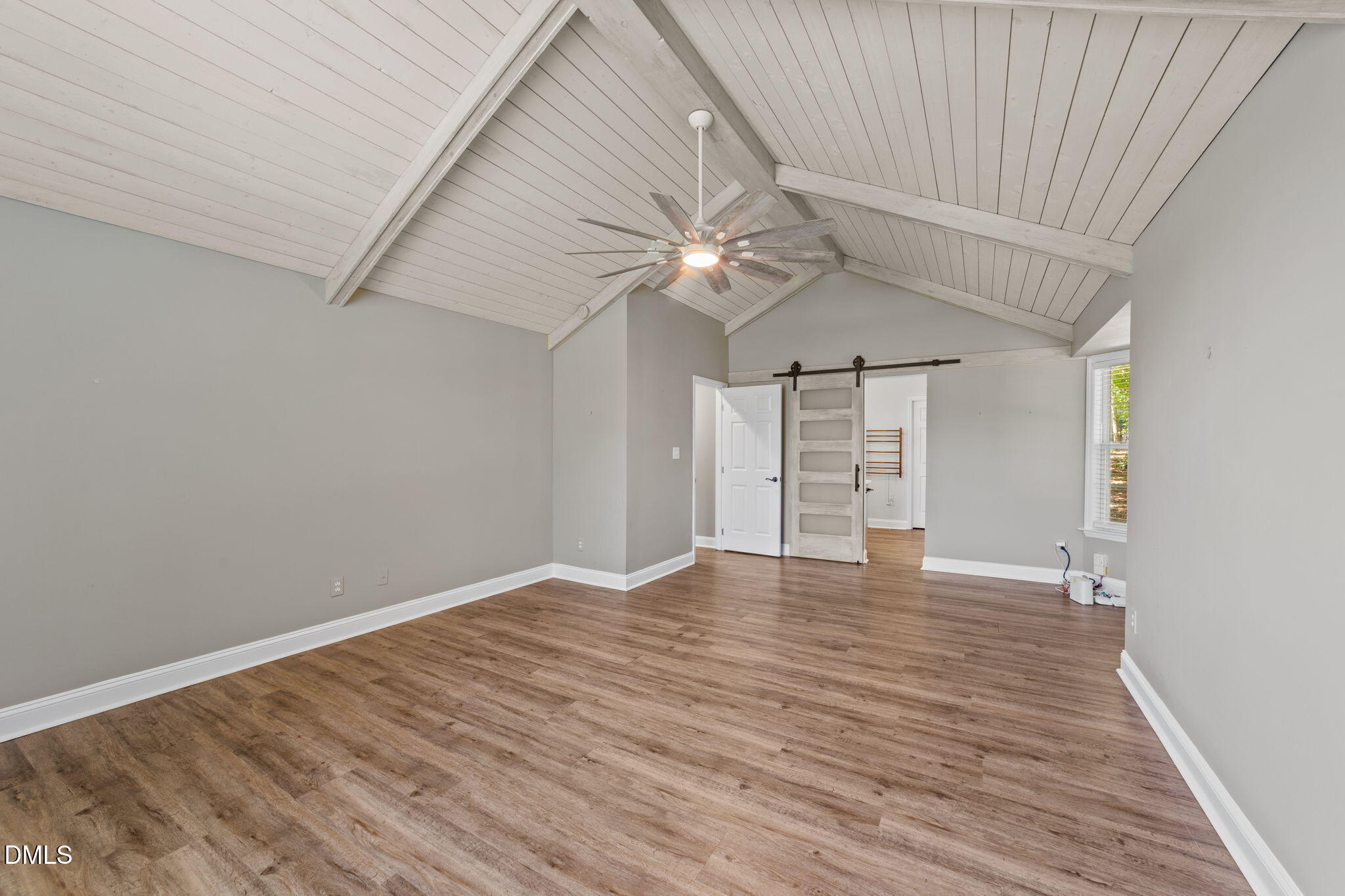 6820 Oviedo Drive Raleigh, NC 27603 - Photo 9 of 50 wooden floor in an empty room with a window