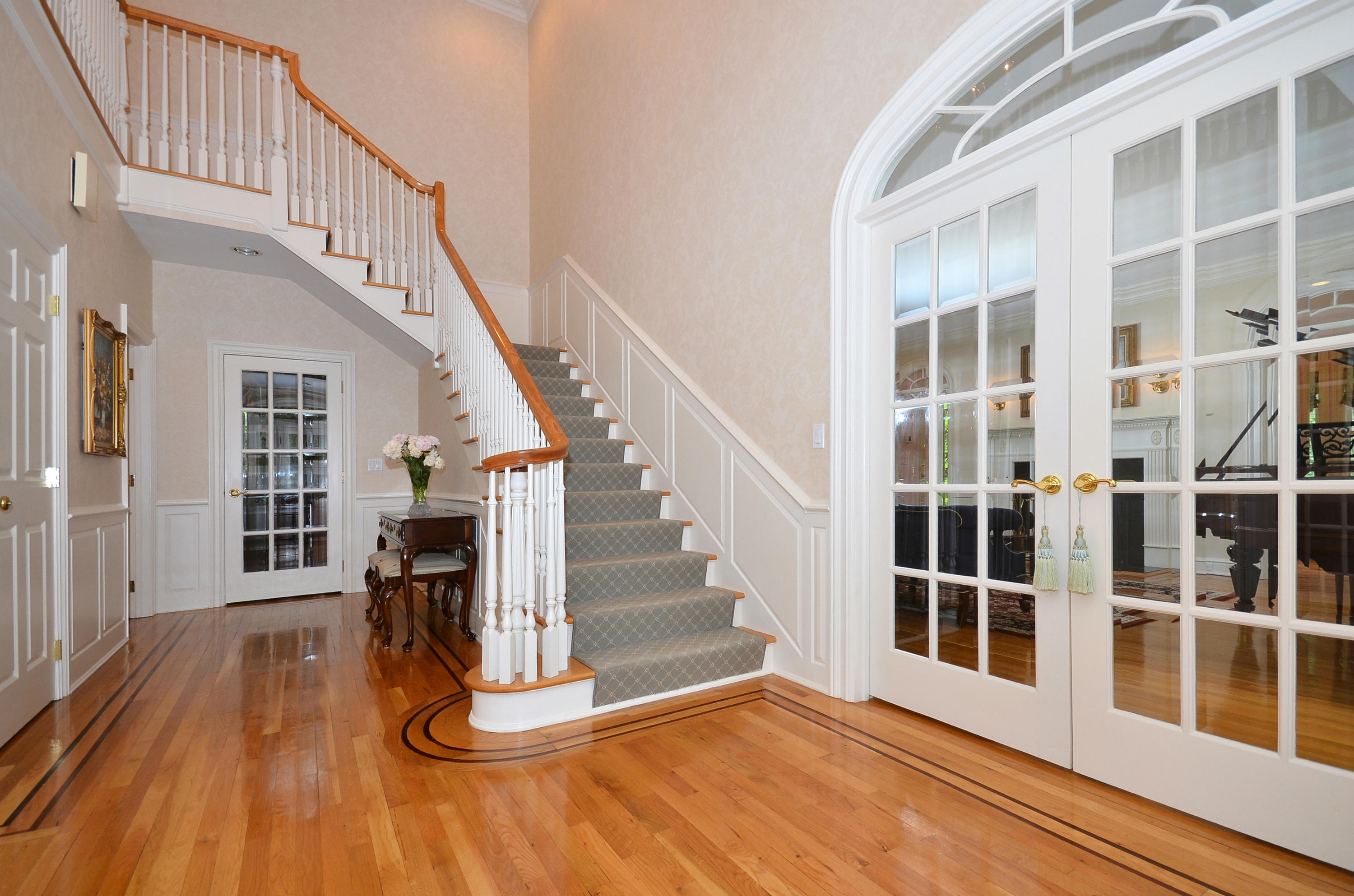 658 Valley Road New Canaan, CT 06840 - Photo 11 of 23 a view of staircase with white walls and windows