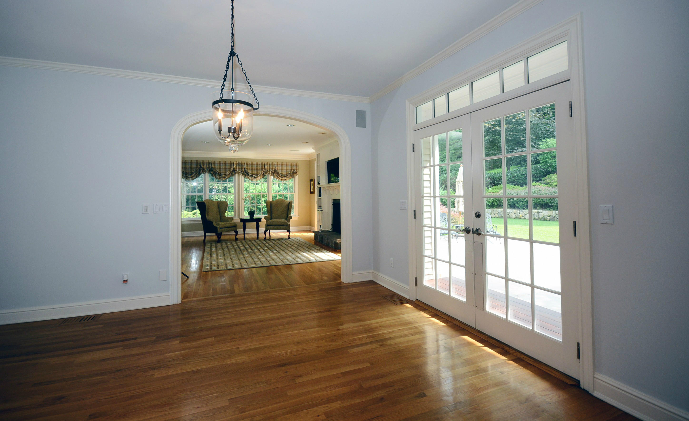 658 Valley Road New Canaan, CT 06840 - Photo 16 of 23 a view of a livingroom with furniture wooden floor a chandelier