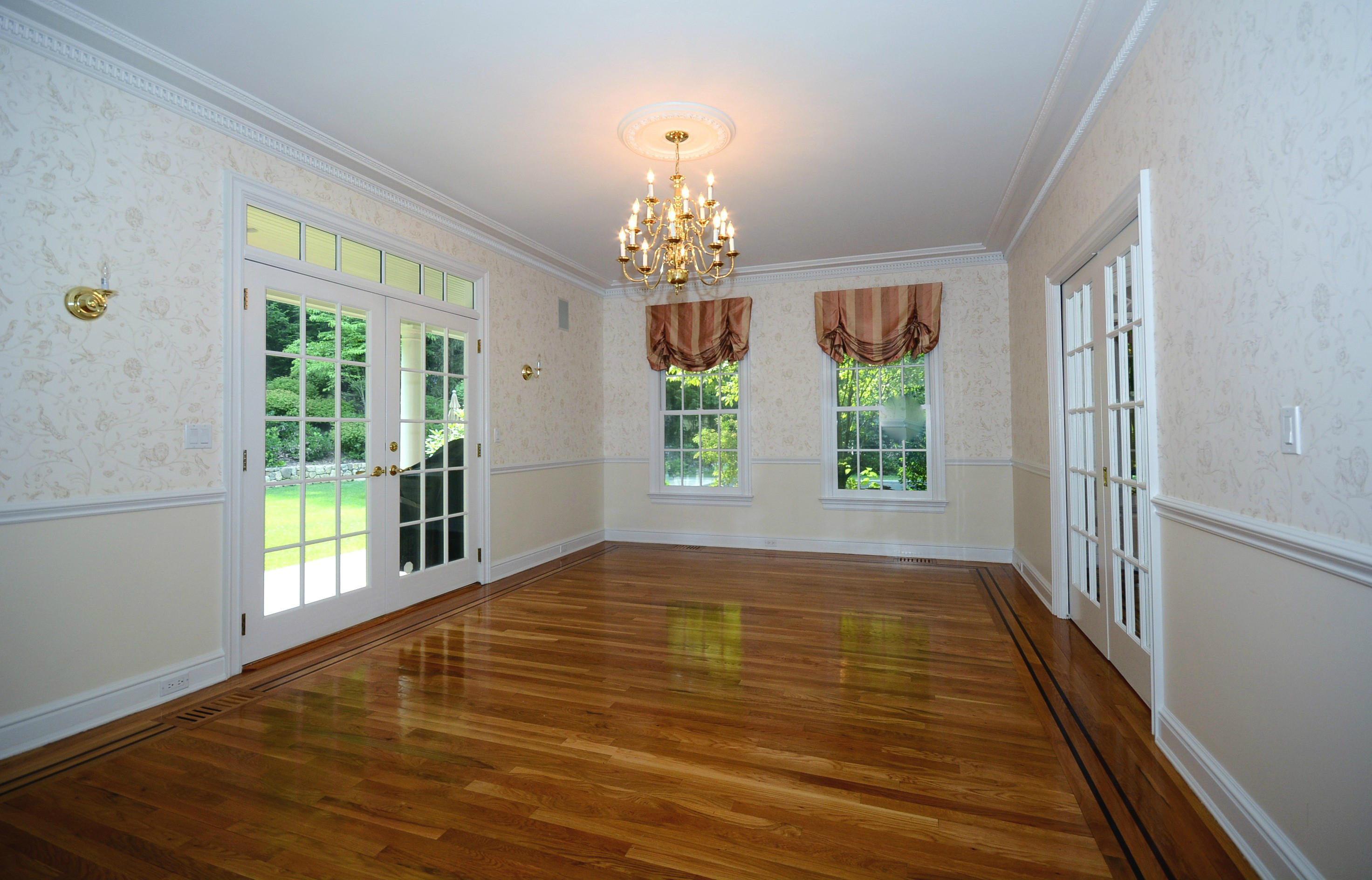 658 Valley Road New Canaan, CT 06840 - Photo 17 of 23 a view of an empty room with wooden floor and a window