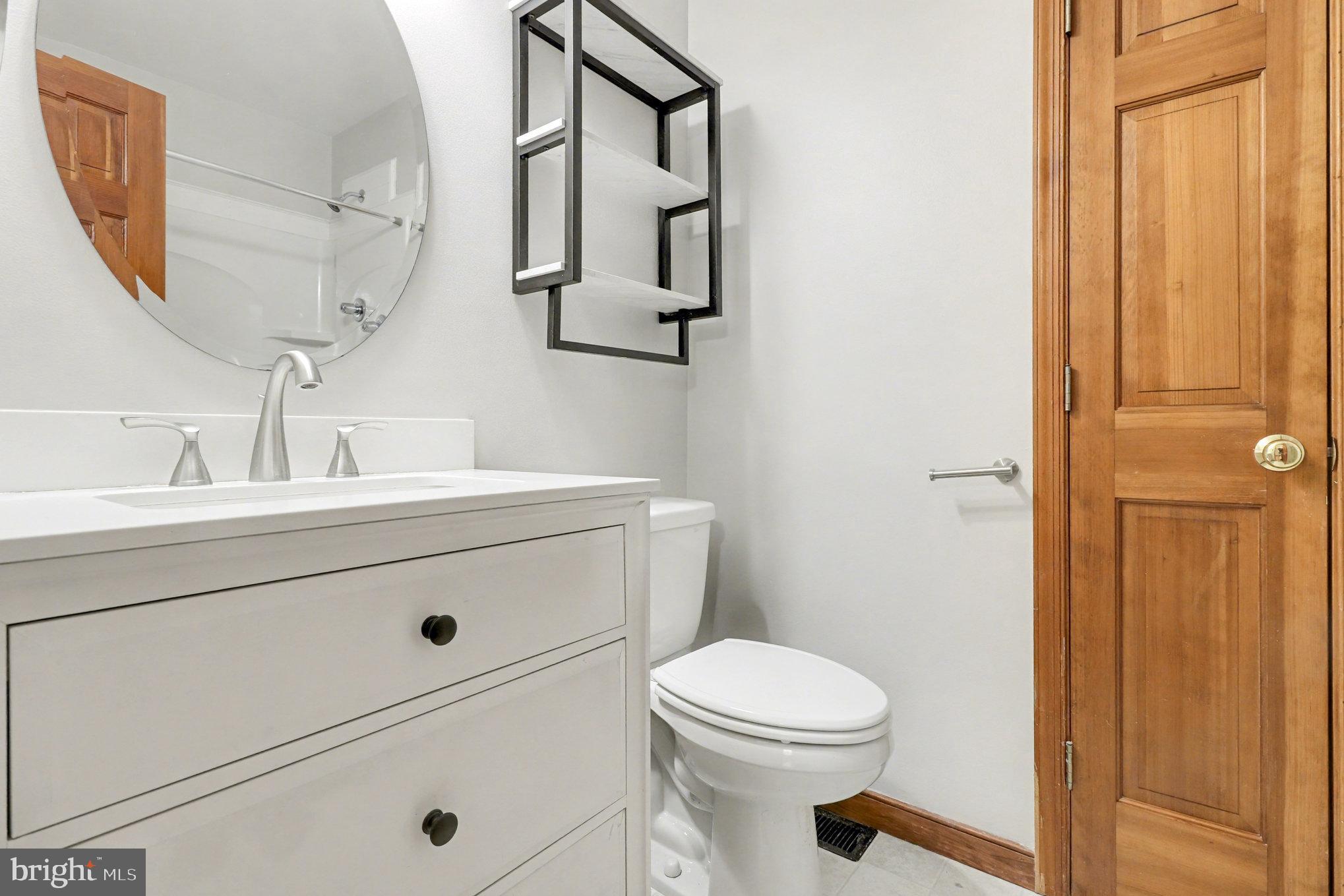 259 Hawkins Farm Road Bumpass, VA 23024 - Photo 13 of 24 a bathroom with a sink a toilet and shower