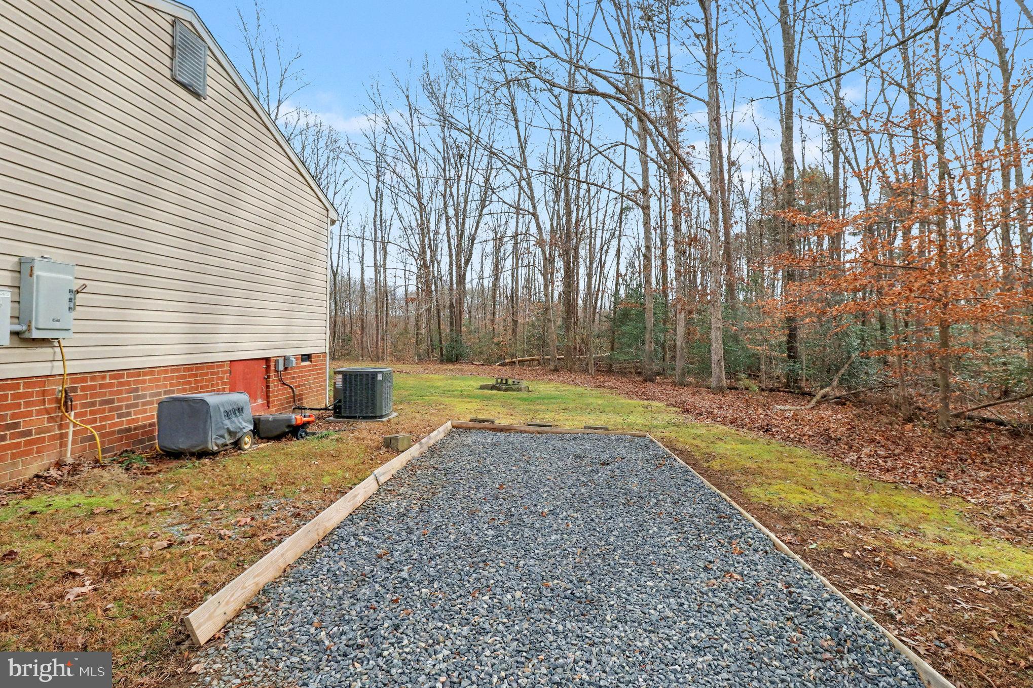 259 Hawkins Farm Road Bumpass, VA 23024 - Photo 20 of 24 a view of a house with swimming pool and sitting area