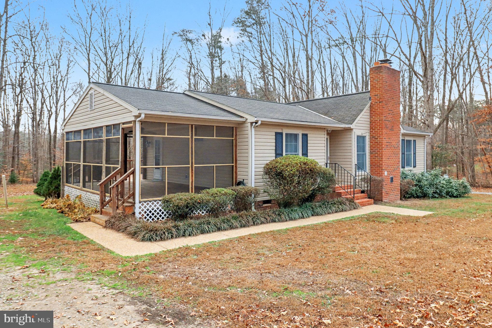 259 Hawkins Farm Road Bumpass, VA 23024 - Photo 2 of 24 a view of backyard of house