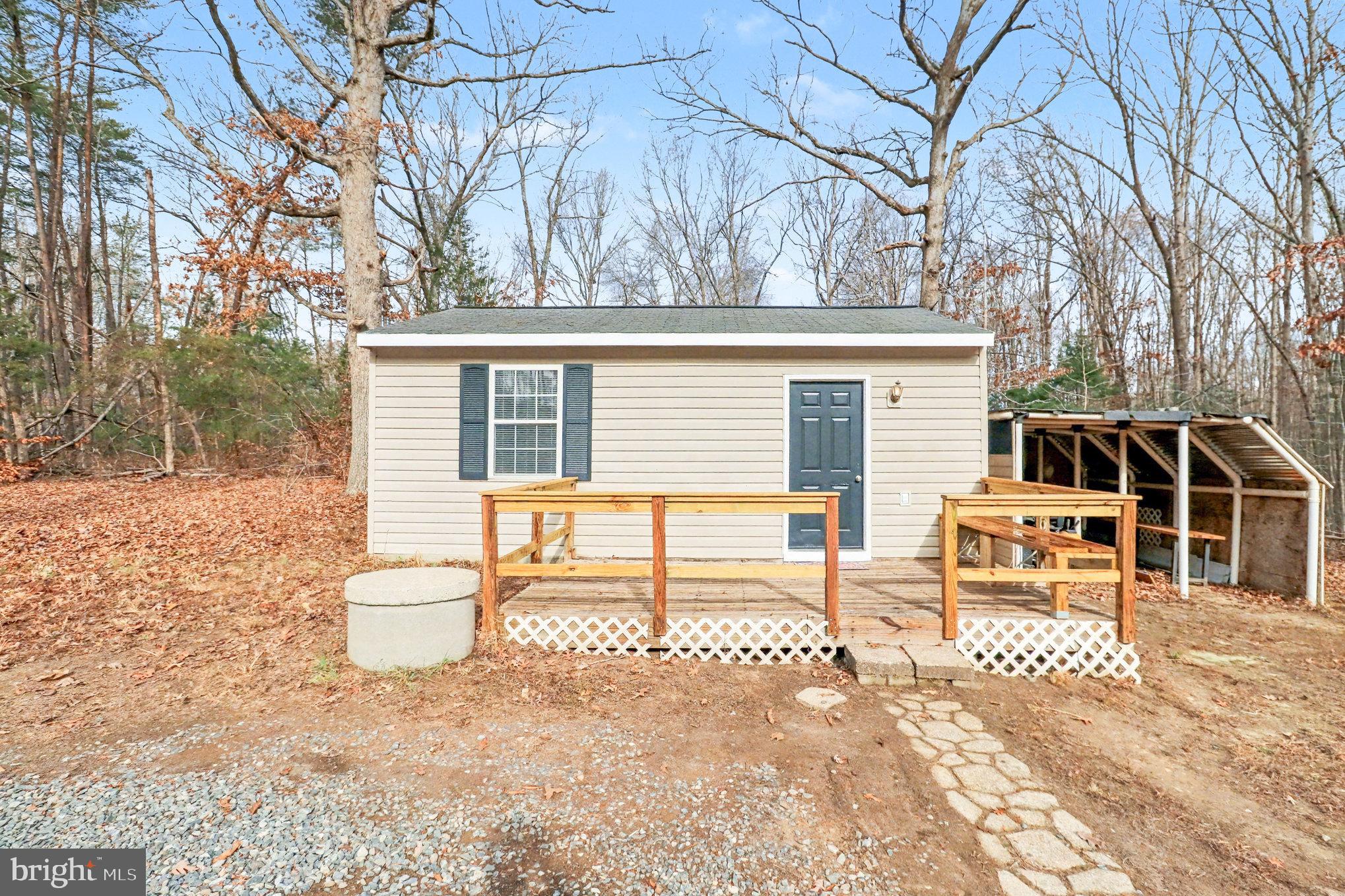 259 Hawkins Farm Road Bumpass, VA 23024 - Photo 21 of 24 a view of a patio with a yard