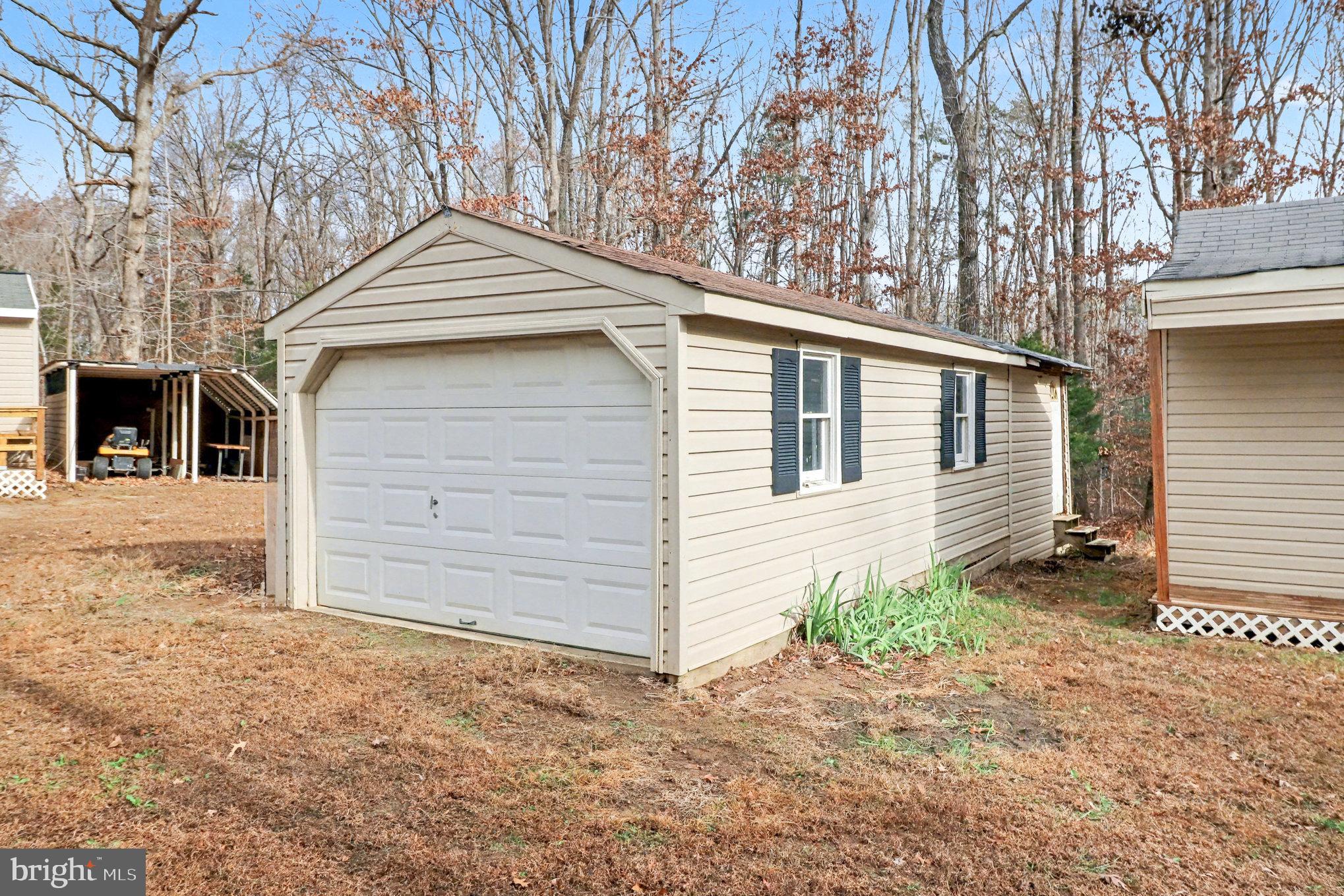 259 Hawkins Farm Road Bumpass, VA 23024 - Photo 23 of 24 a view of a house with a yard