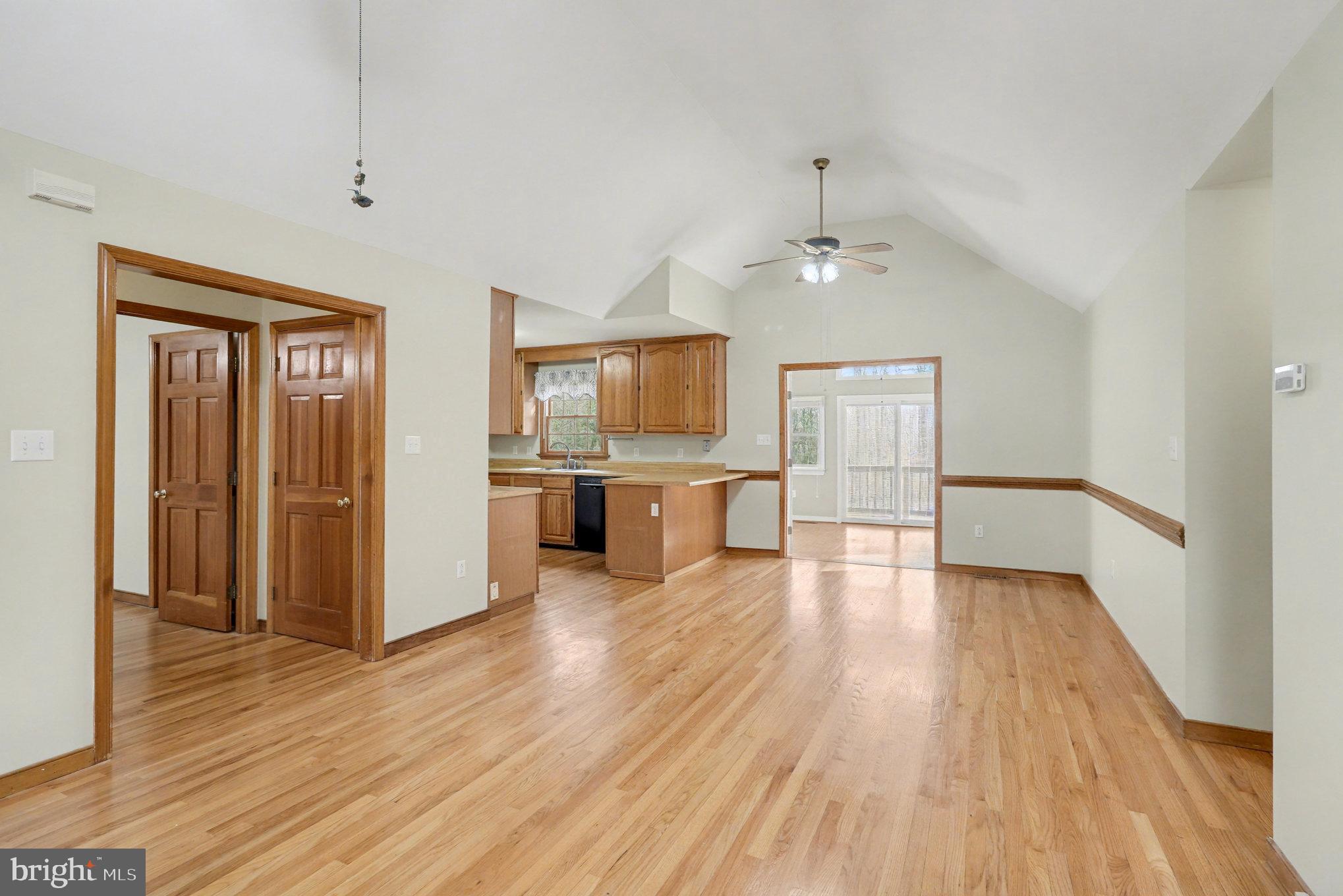 259 Hawkins Farm Road Bumpass, VA 23024 - Photo 3 of 24 a view of a kitchen with a sink a refrigerator and wooden floor