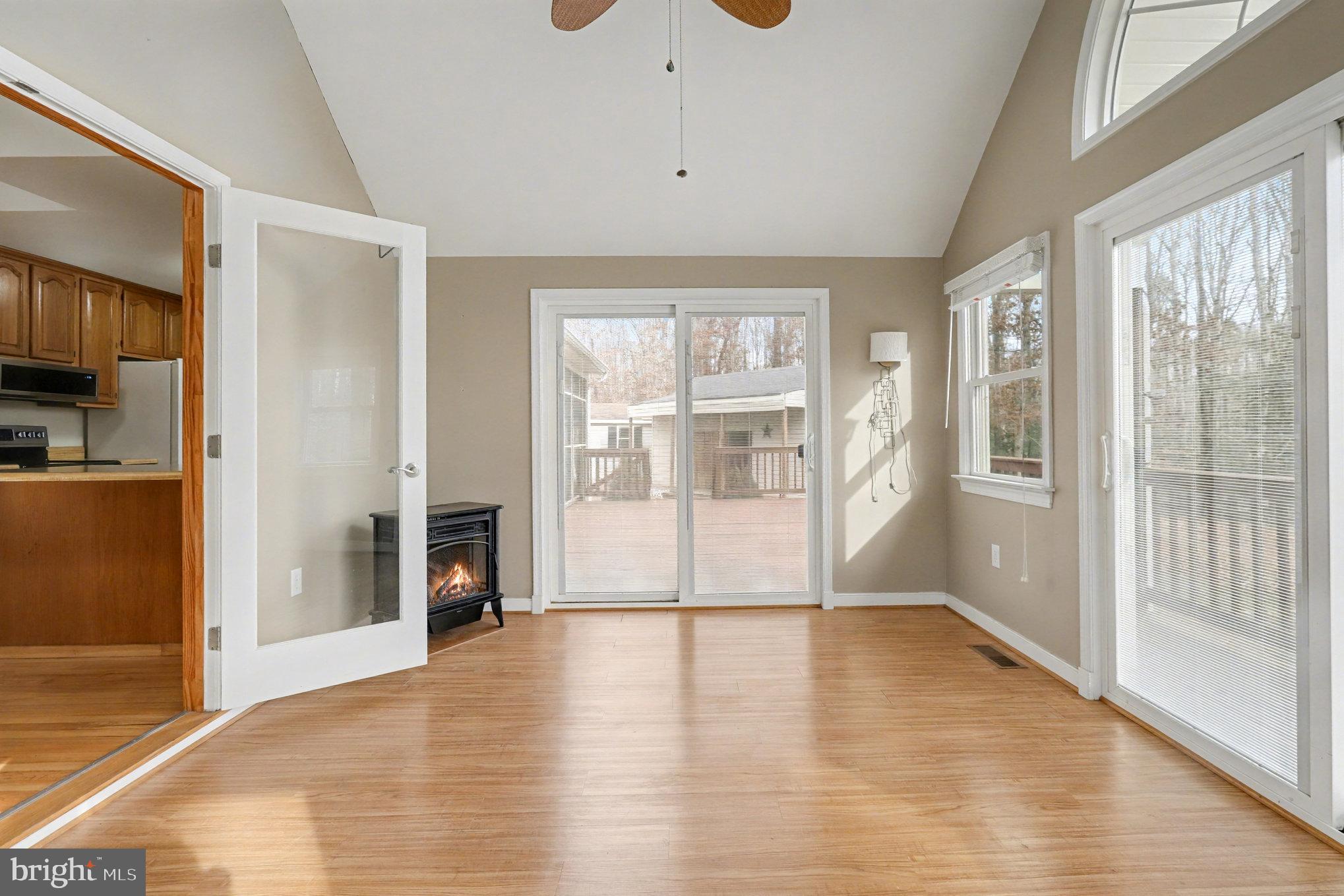259 Hawkins Farm Road Bumpass, VA 23024 - Photo 10 of 24 a view of empty room with wooden floor and fan